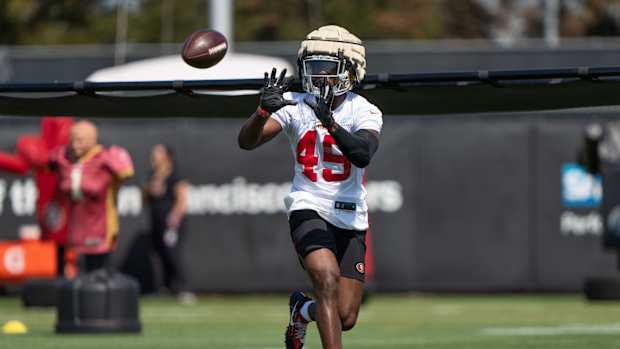 Jul 28, 2022; Santa Clara, CA, USA; San Francisco 49ers linebacker Segun Olubi (49) makes a catch during training camp at the SAP Performance Facility near Levi Stadium.